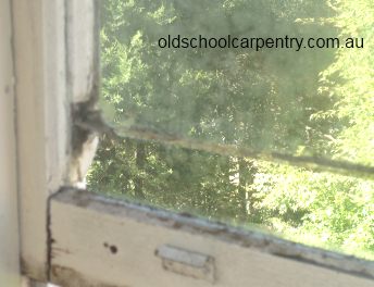 glass pane needing new bottom in window to hold it in